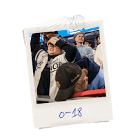 a photo of a young boy at a baseball game